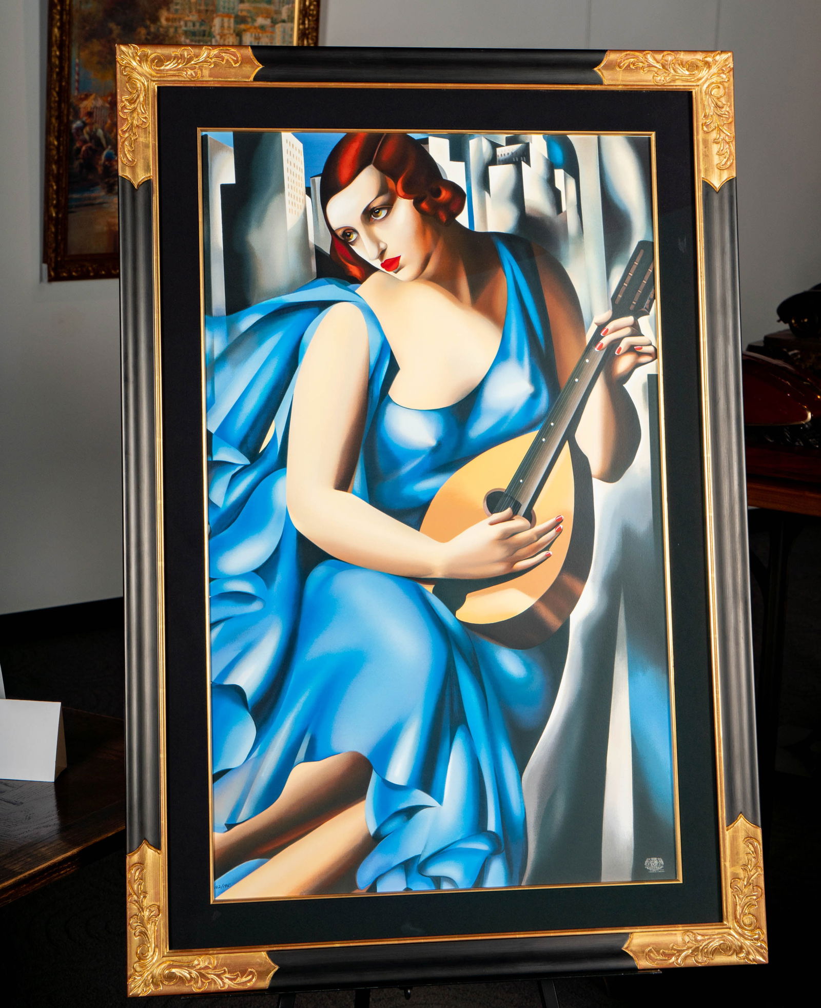 Tamara de Lempicka (1898-1980): The Musician: print editioned 182/195 to lower left, with artist's stamp lower right Total with frame: 47 x 32 1/2 in. (119.4 x 82.6 cm.)