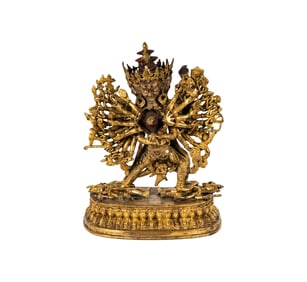 A Tibetan Gilt Bronze Figure of a Deity