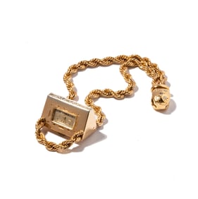 A Retro Era 14 Karat Yellow Gold Diamond Pyramid-Shape Watch