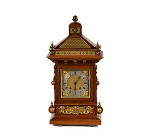 A Junghans Walnut and Brass Mantel Clock