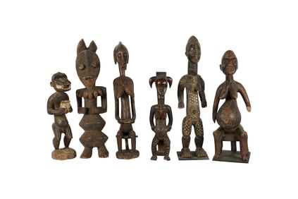 A Group of Six African Carved Wood Figures