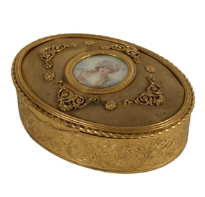 A French Oval Gilt Metal Vanity Box