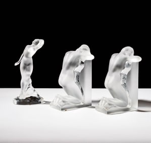 A Pair of Lalique Reverie Bookends and a Danseuse Bras Baisse Figure