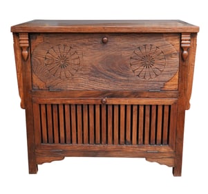 An Indonesian Carved Wood Drop Front Cabinet