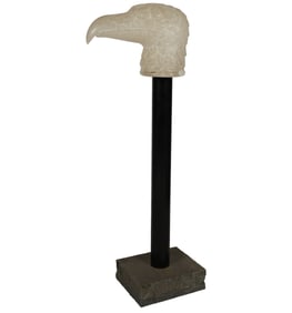 A Carved Stone Eagle's Head on Stand
