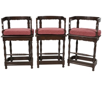 A Set of Three Carved Oak Bar / Counter Stools