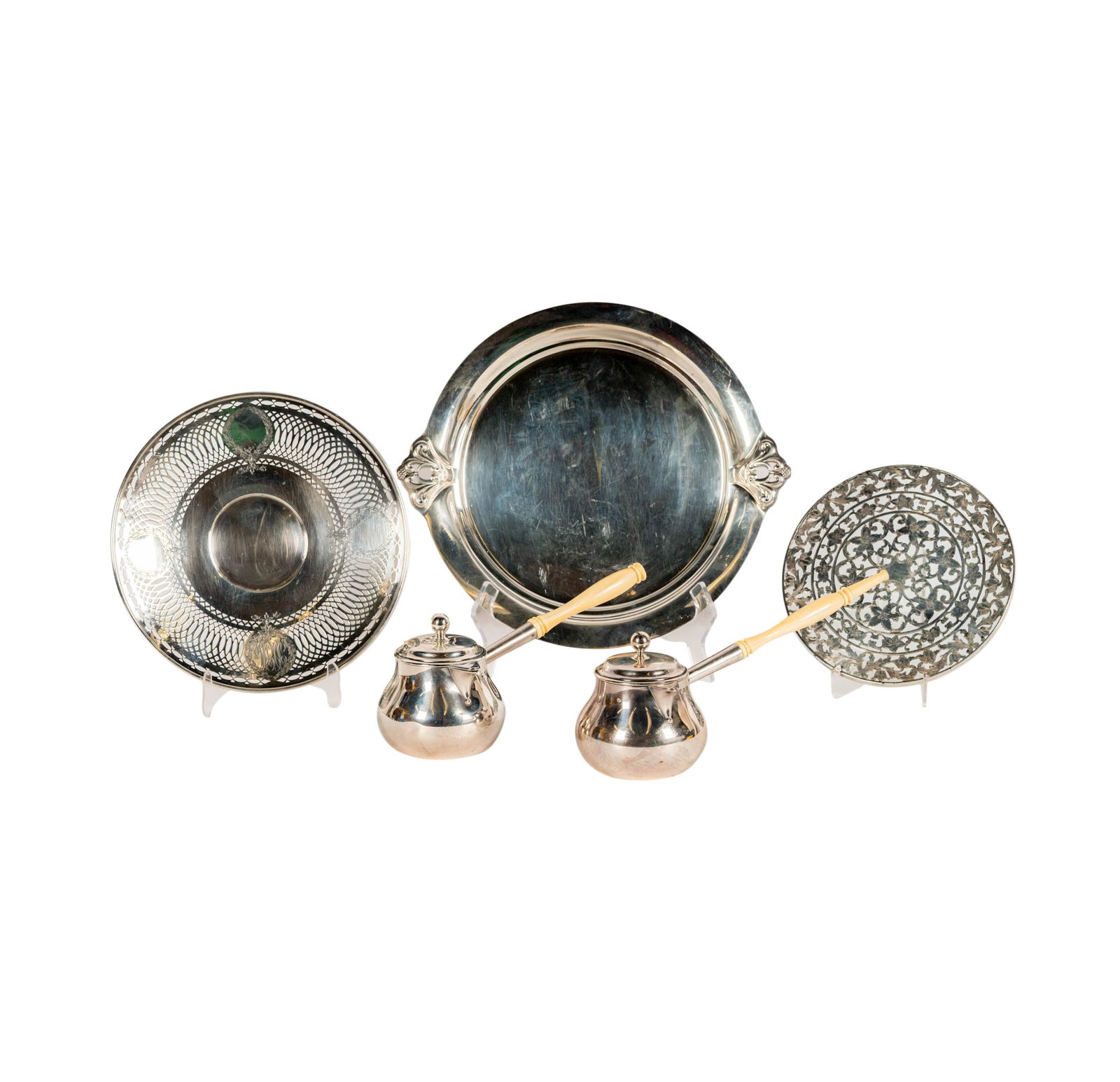 A Group of American and English Sterling Serving Articles: comprising a Webster sterling overlay and glass trivet, with maker's mark and further marked "Sterling" (Approximately 530 grams gross, 8 in. dia.); an American round plate with reticulated rim marked