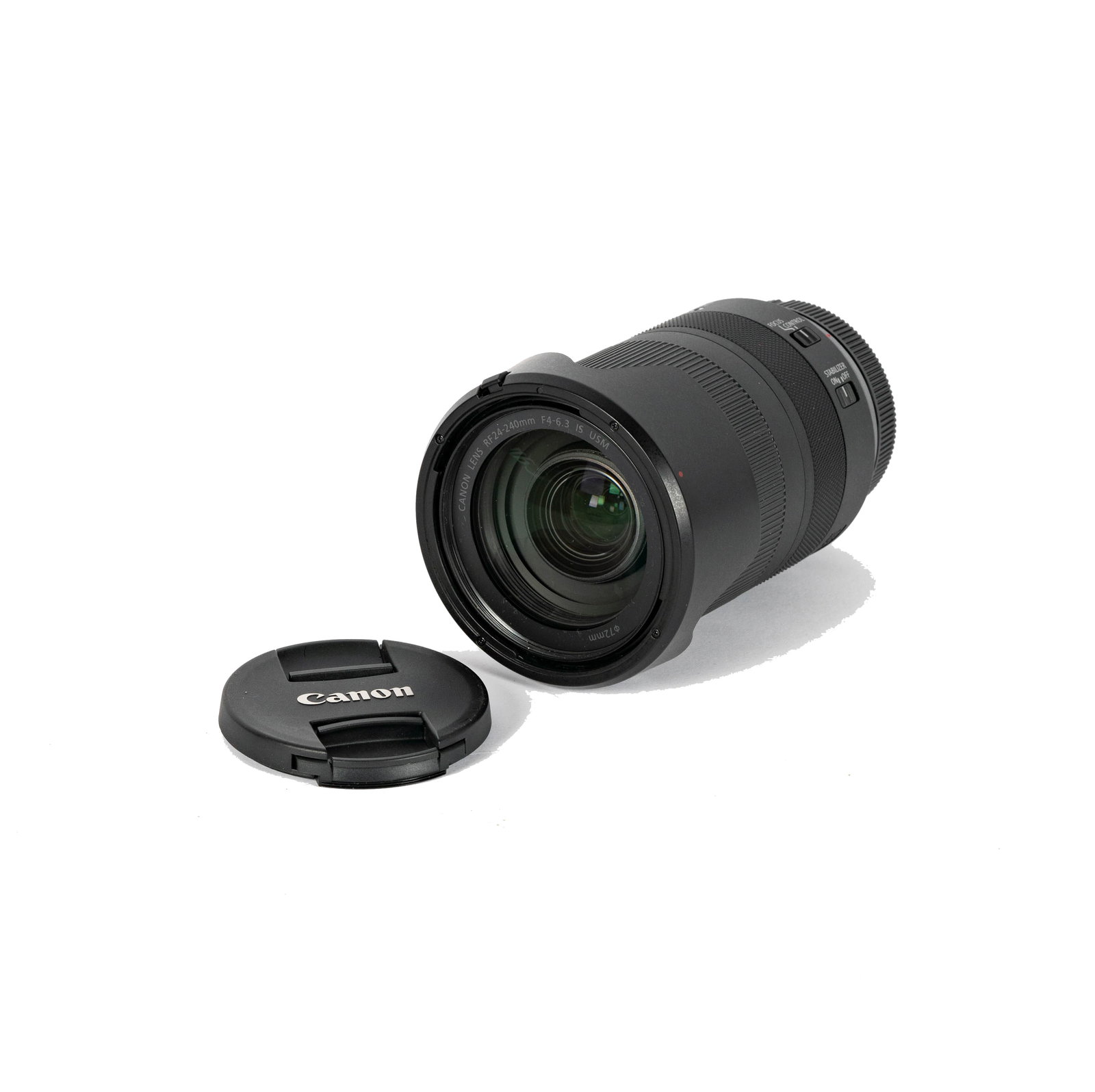 A Canon RF 24-240mm Lens: with lens hood and both end caps 5 3/4 in. (14.6 cm.)