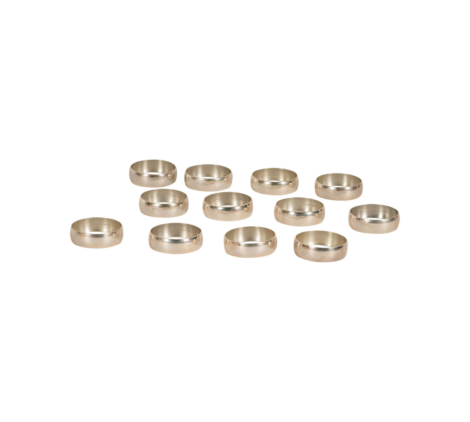A Set of 12 Gorham Sterling Napkin Rings: with makers marks and further marked "Sterling 1332", Approximately 136 grams total Each 1 3/4 in. (4.4 cm.) dia.