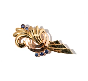 One 14 Karat bi-color Gold, Sapphire Brooch