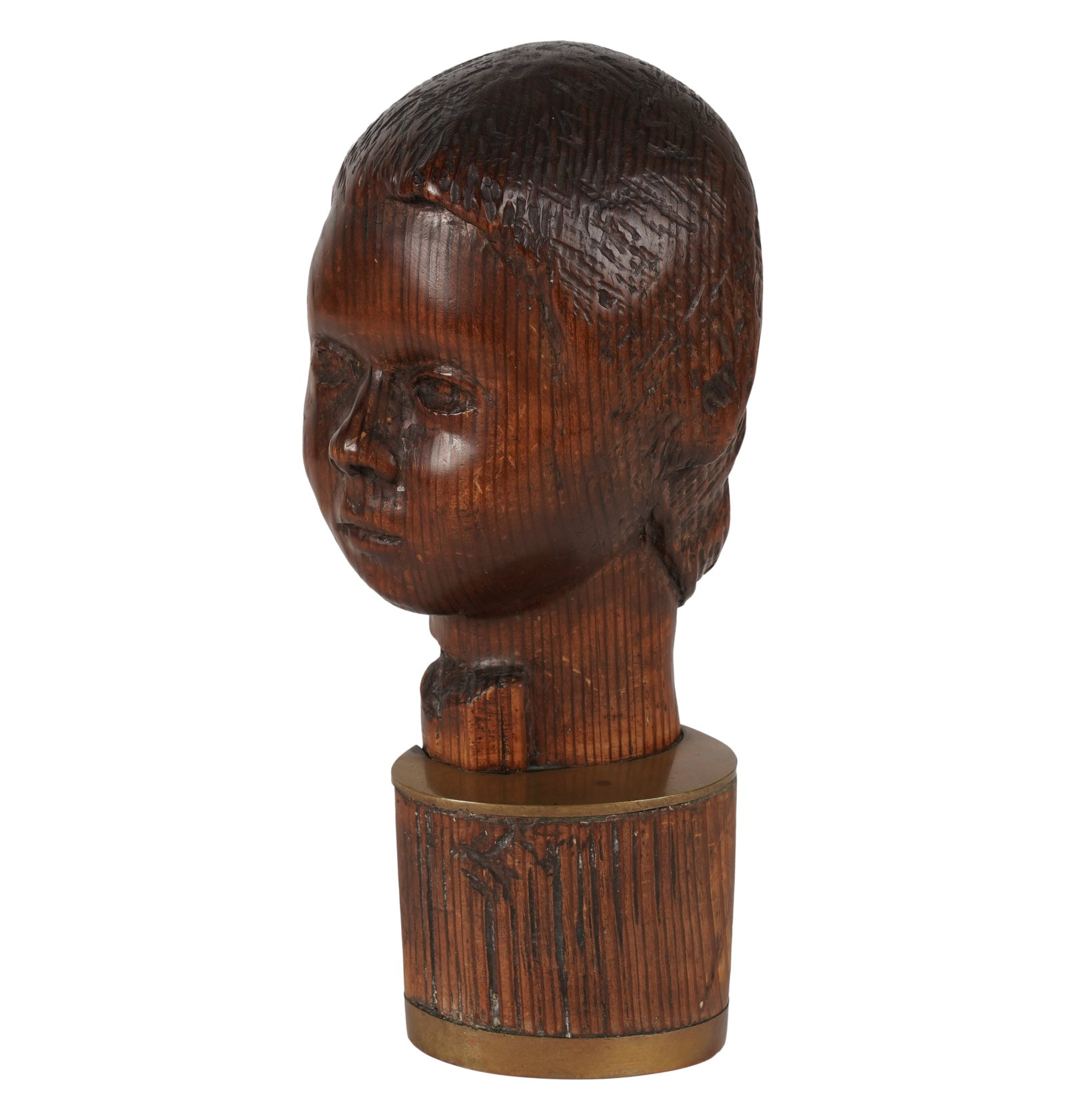 A Carved Wood Head of a Child: mounted on a brass support 12 x 4 3/4 x 5 in. (30.5 x 12.1 x 12.7 cm.) Provenance: Property from the collection of George Doan, Philadelphia, PA. and Rancho Mirage, CA; Collection of Willavene Morris,