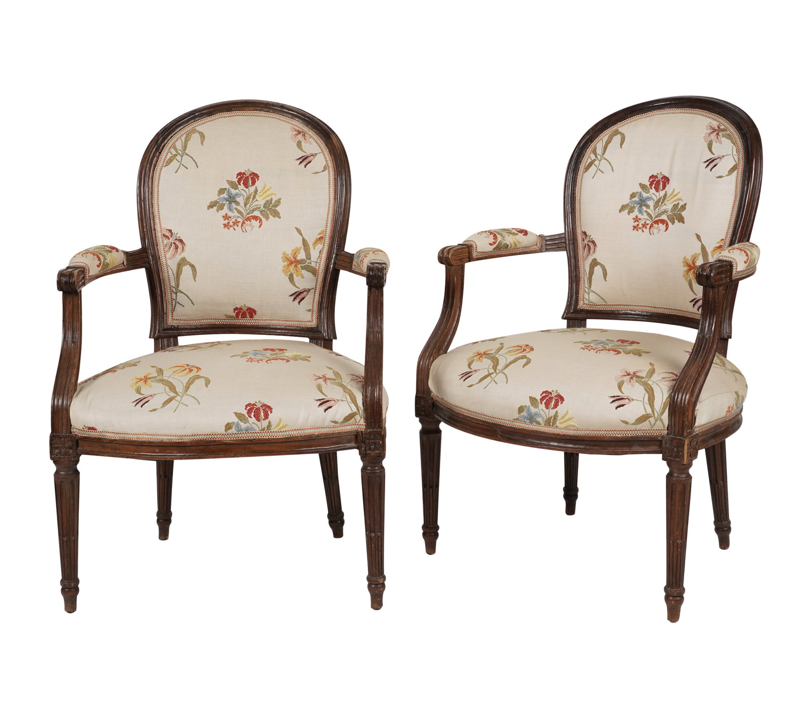 A Pair of Antique Louis XVI-Style Fauteuils: 19th century; covered with later French floral-embroidered cotton fabric 35 1/2 x 23 1/2 x 21 in. (90.2 x 59.7 x 53.3 cm.), Seat height: 16 in. (40.6 cm.) Provenance: Property from the collection of G