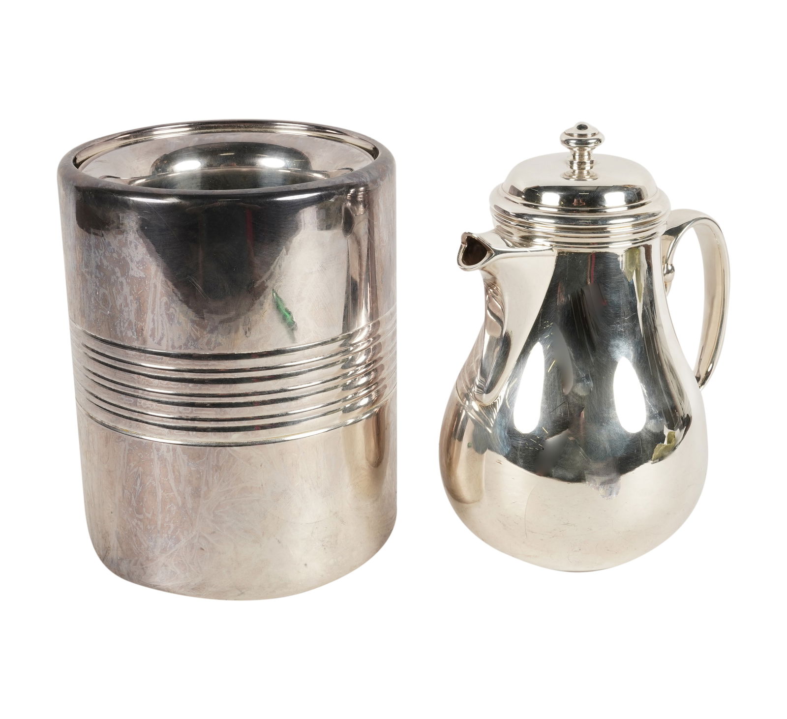 A Christofle Silverplate Teapot and Wine Cooler: each with maker's mark Teapot: 8 in. (20.3 cm.), Wine cooler: 7 1/2 x 5 3/4 in. (19.1 x 14.6 cm.)