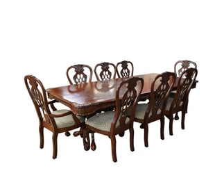 A Carved Wood Dining Set