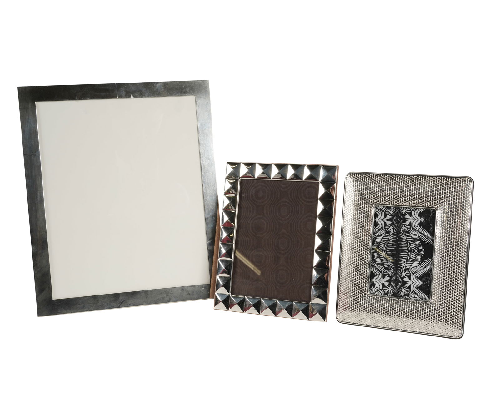 Three Sterling Silver Picture Frames: each marked "925" Largest: 13 1/2 x 11 1/4 in. (34.3 x 28.6 cm.), Smallest: 8 1/2 x 7 in. (21.6 x 17.8 cm.)