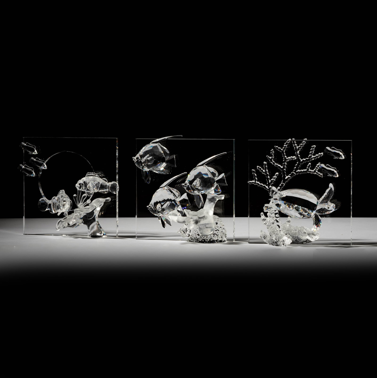 A Swarovski Crystal Wonders of The Sea Trilogy: dated 2005, 2006, and 2007; each marked to underside Clown fish group: 7 1/2 x 8 1/4 in. (19.1 x 21 cm.) Notes: This item does not qualify for in-house shipping. Please see our preferred shippers list