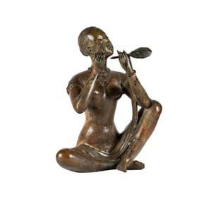 A Figure of a Woman Holding a Mirror