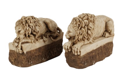 A Pair of Carved Stone Recumbent Lion Figures