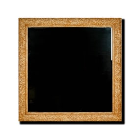 A Carved Bleached Wood Mirror