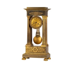 A French Empire Gilt Bronze Portico Clock