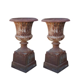 A Pair of Neoclassical-Style Iron Urns on Pedestals