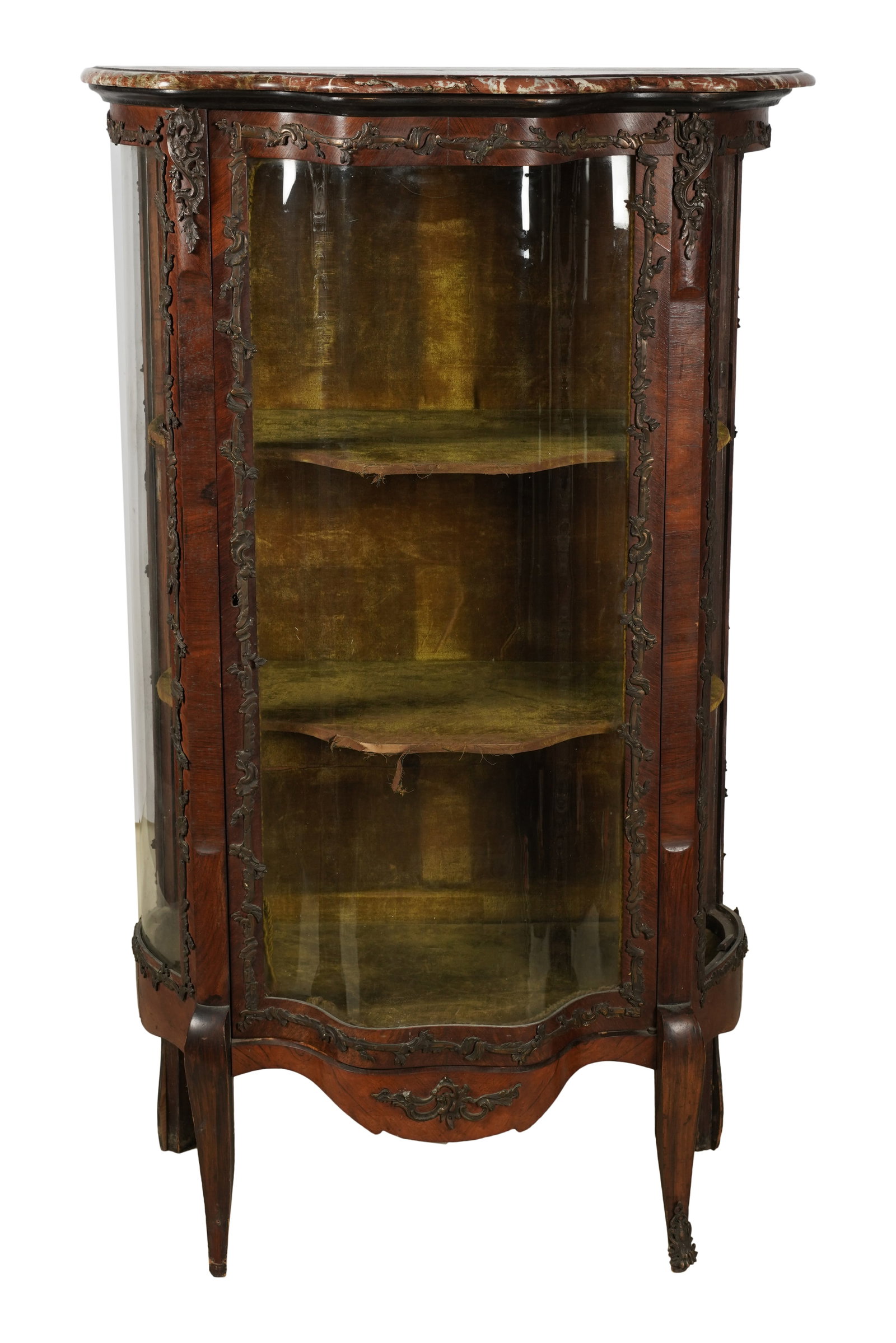 A Louis XV-Style Marble-Top Vitrine Cabinet: of serpentine form, with velvet-lined interior 57 1/2 x 33 1/2 x 18 1/2 in. (146.1 x 85.1 x 47 cm.) Notes: This item does not qualify for in-house shipping. Please see our preferred shippers list for 