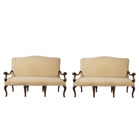 A Pair of Provincial Carved Walnut Settees