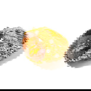 Janis Paige: 18 Karat Yellow Gold, Diamond and Citrine Ring: set with one oval shape citrine weighing approximately 26.75 carats and accented with 10 small full-cut diamonds weighing approximately .5 carats; size: 6-1/2, weighing 33.4 grams; Provenance: The