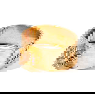 Janis Paige: 14 Karat Yellow Gold, Citrine and Ruby Hinged Bangle: set with one large citrine weighing 18 carats and accented with 6 round rubies weighing .06 carats; measuring 7-1/4 inches inside, weighing 54.3 grams; Provenance: The Estate of Janis Paige, Bel Air