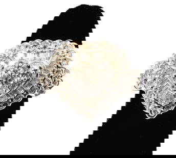 Janis Paige: 18 Karat White Gold Diamond Heart Ring: set with 39 round diamonds and 34 baguette-shaped diamonds[I-K/SI3] weighing approximately 1.40 carats in total diamond weight; size: 5-1/4, weighing 7.8 grams; Provenance: The Estate of Janis Paige,