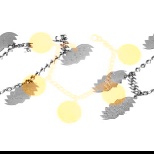 Janis Paige: Yellow Gold Filmography Charm Bracelet: with 10 karat curb link chain accented with 14 karat charms, bracelet measuring 7 inches long by 3.92mm wide, pendants measuring 21.08mm in diameter; weighing 25.1 grams; Provenance: The Estate of