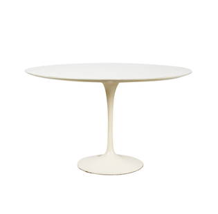 Eero Saarinen for Knoll: Tulip Dining Table: designed white laminate, white enameled steel; with round top; label to underside of top "Knoll International 655 Madison Avenue New York, N.Y. 10022" 29 x 48 in. (73.7 x 121.9 cm.) Provenance: Proper