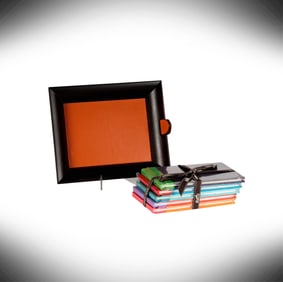 An Hermes Wood and Leather Tray and Set of Hermes Cahiers