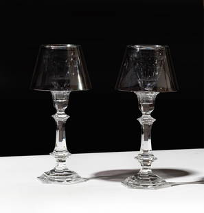 Philippe Starck for Baccarat: Two Harcourt Our Fire Crystal Candlesticks: with two shades in silver and one shade in red Candlesticks: 13 x 5 3/4 in. (33 x 14.6 cm.), With two Baccarat boxes, Each 8 x 14 1/4 x 12 1/4 in. (20.3 x 36.2 x 31.1 cm.) Notes: This item does not qu