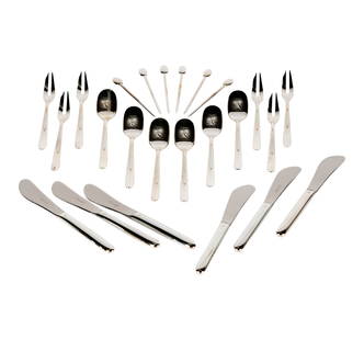 A Christofle Mood Appetizer Set: comprising a set of silver-plate utensils (six butter spreaders, 6 1/8 in., six verrine spoons, 5 1/4 in., six cocktail forks, 5 1/4 in., and six cocktail picks, 3 5/8 in.), in an egg-shaped polished