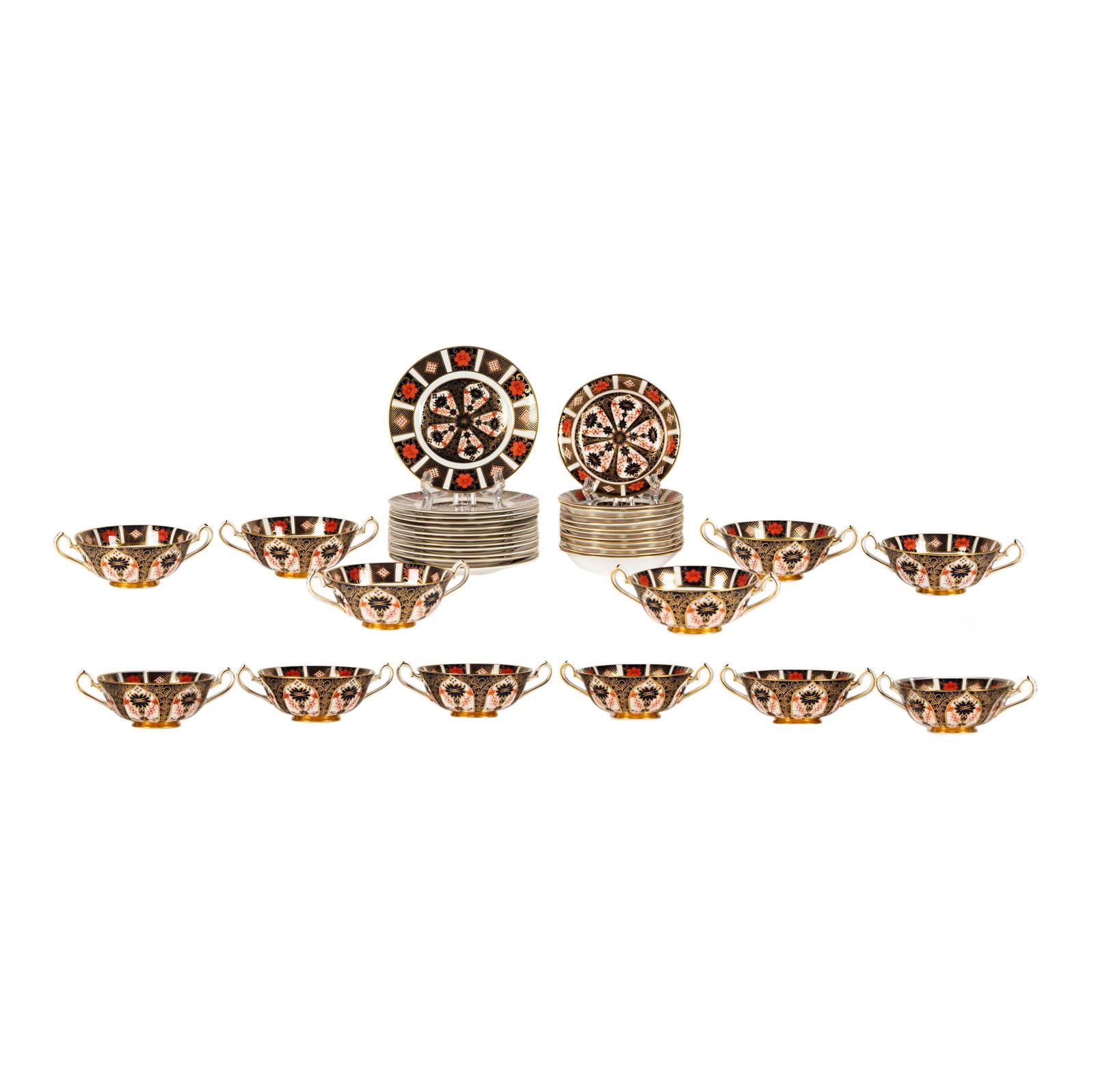 A Royal Crown Derby Old Imari Bone China Partial Service: variously dated from 1973 - 1979; comprising 12 bread plates (6 1/4 in. dia.), 12 fruit dishes (5 1/4 in. dia.), and six cream soup bowls (4 3/4 in. dia.); each with printed backstamp and date mark [3