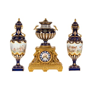 A Sevres-Style Cobalt Porcelain Three-Piece Clock Garniture
