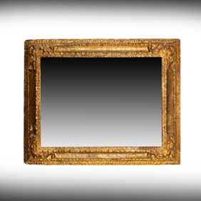 An Antique Carved Giltwood Wall Mirror