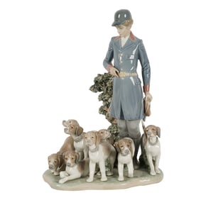 A Lladro Figure of a Hunter With Dogs