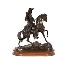 An Orientalist Patinated Bronze Figure of a Man on Horseback