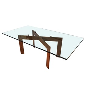 A Glass and Patinated Iron Dining Table