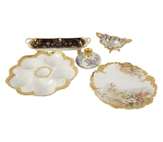 A Group of Gilt-Decorated Porcelain Table Articles