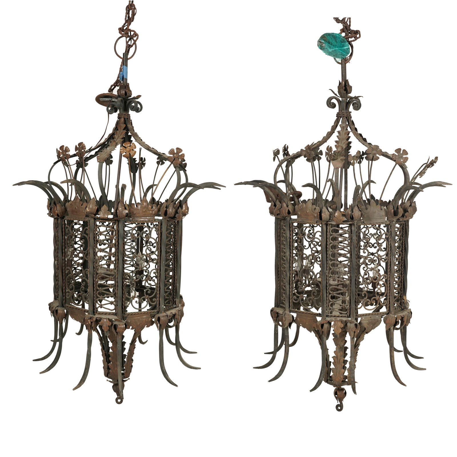 A Pair of Monumental Lanterns: iron and gilt or brass-finish metal 62 x 32 in. (157.5 x 81.3 cm.) This item does not qualify for in-house shipping. Please refer to our preferred shipper's list at https://www.abell.com/buy-sell/how-