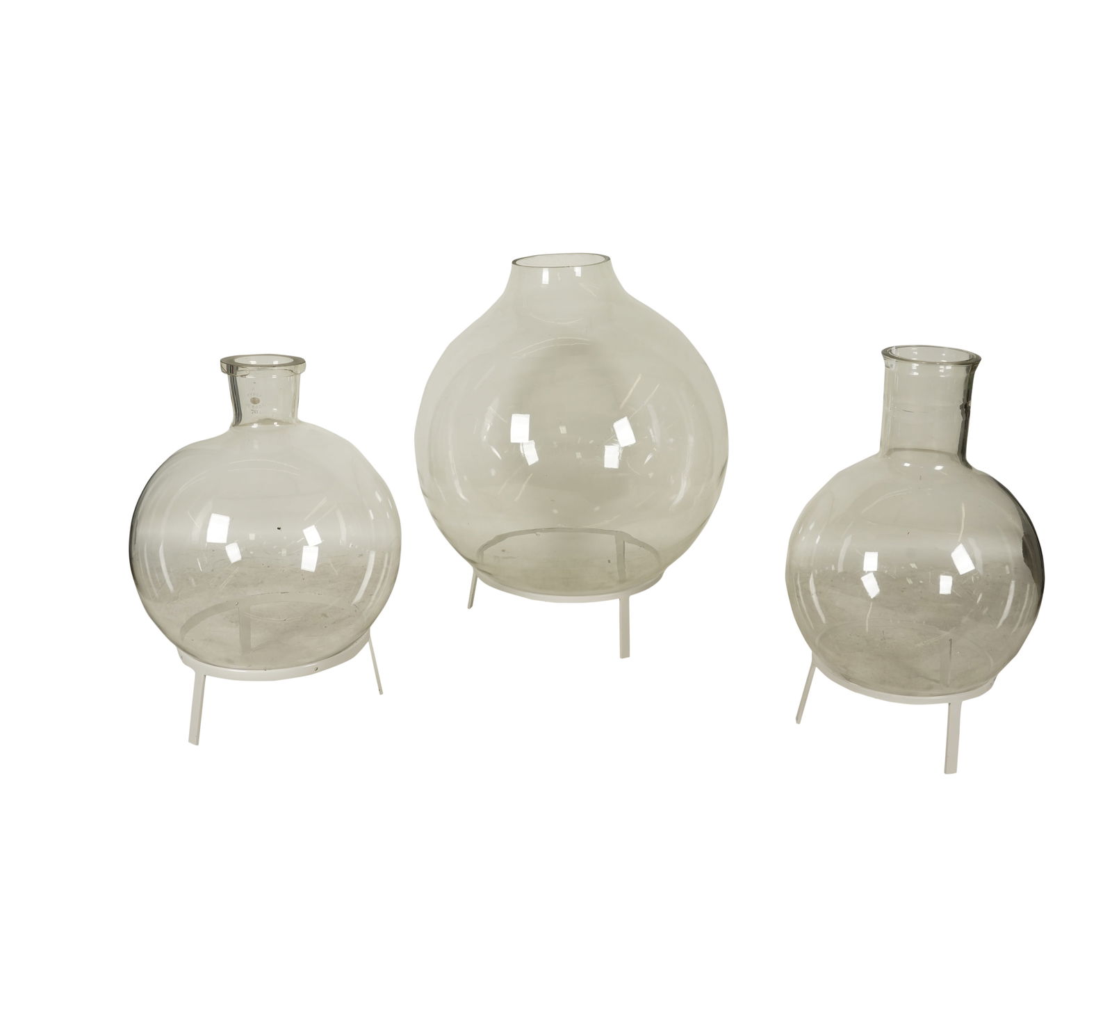 Three Large Glass Boiling Flasks: each with metal stand; two marked "PYREX" Largest including stand: 38 x 29 in. (96.5 x 73.7 cm.) Notes: This item does not qualify for in-house shipping. Please see our preferred shippers list for quo