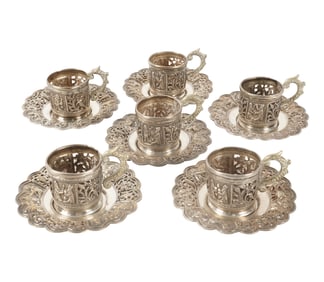 A Set of Six Demitasse Cup Holders and Saucers