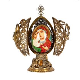 A Russian Gilt Metal Filigree Icon Egg