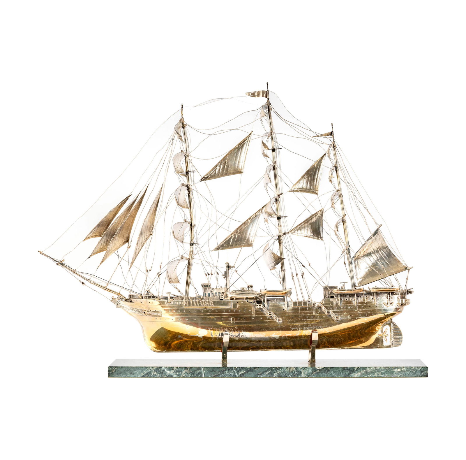 A Machado Joalheiro Silver Clipper Ship Model: marked "925" to one sail; on marble plinth Overall: 21 1/2 x 27 x 6 in. (54.6 x 68.6 x 15.2 cm.) Notes: This item does not qualify for in-house shipping. Please see our preferred shippers' list for qu