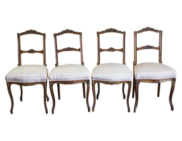 A Set of Four Carved Wood Side Chairs