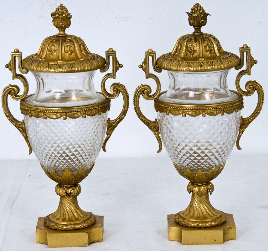 PAIR OF CUT CRYSTAL COVERED URNS: each with ormolu mounts; in the Neoclassic taste 18 inches high