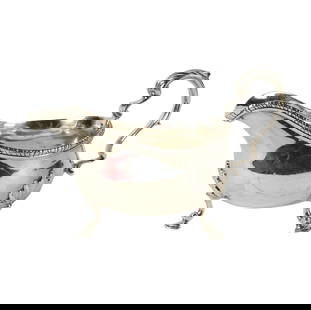 A George II Sterling Sauce Boat: marked for London, 1757 and with partially obliterated maker's mark; Approximately 410 grams4 1/2 x 8 x 4 in. (11.4 x 20.3 x 10.2 cm.)